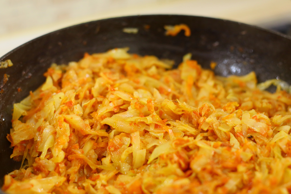 Braised White Cabbage. fried cabbage in a pan