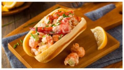 A fresh lobster roll served with waffle fries