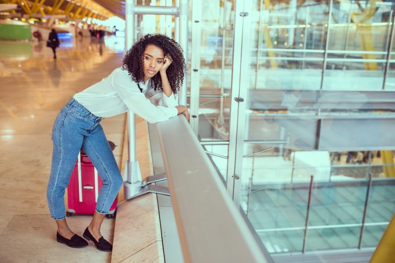 Woman who missed her flight - Depositphotos