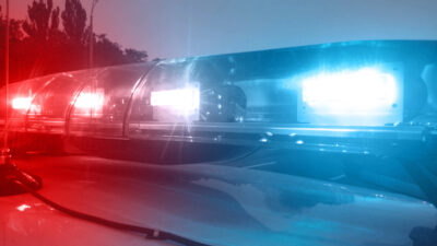 Emergency vehicle lights flashing, police car