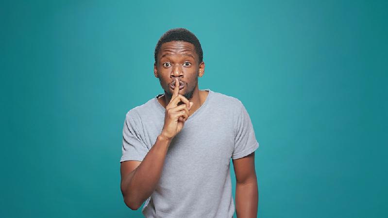 Keeping A Secret - African American male - Depositphotos