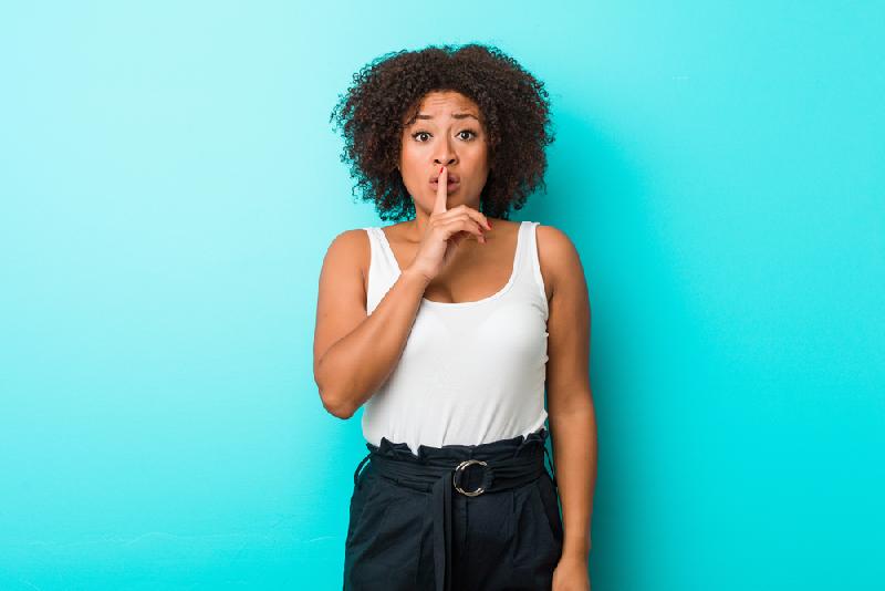 Why Keeping Secrets Tests Trust and Integrity // Keeping A Secret - African American woman - Depositphotos