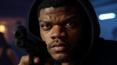 Lamar Jackson (with gun and hoodie for Raising Kanan) - via Grok AI