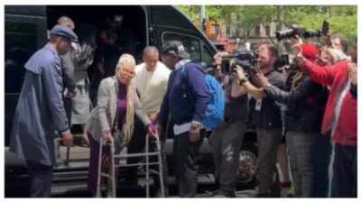 Misa Hylton uses walker to support son Justin at his father's trial