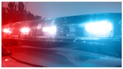 Emergency vehicle lights flashing, police car