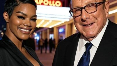 Teyana Taylor and Clive Davis in front of Apollo Theater - via Grok AI