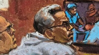 Diddy Trial - Diddy in gray pullover top
