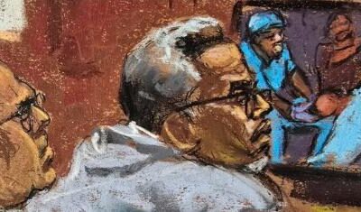 Diddy Trial - Diddy in gray pullover top