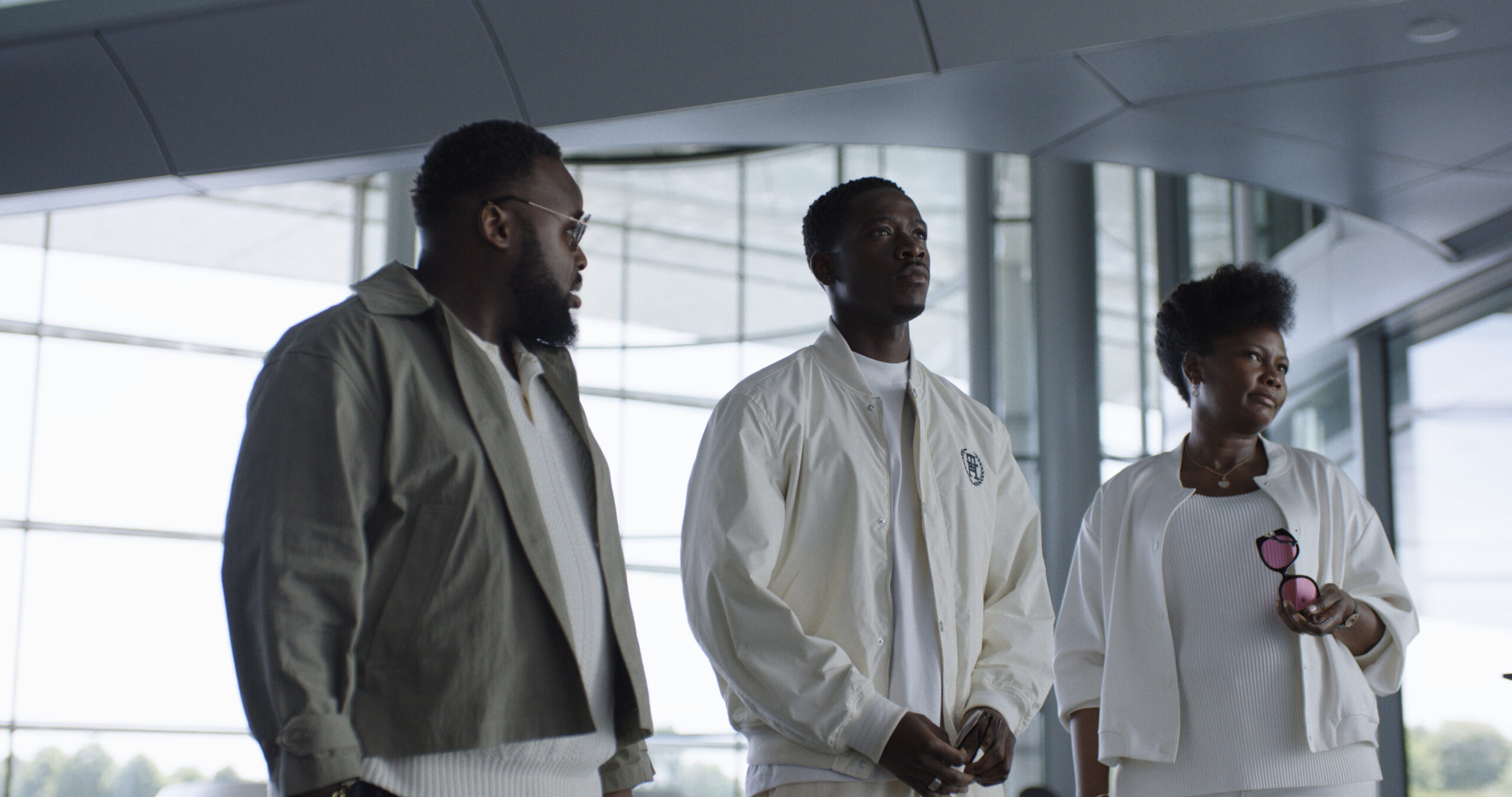 (L-r) SAMSON KAYO as Cash, DAMSON IDRIS as Joshua Pearce and SARAH NILES as Bernadette in Apple Original Films&rsquo; &ldquo;F1&reg; The Movie,&rdquo; a Warner Bros. Pictures release.