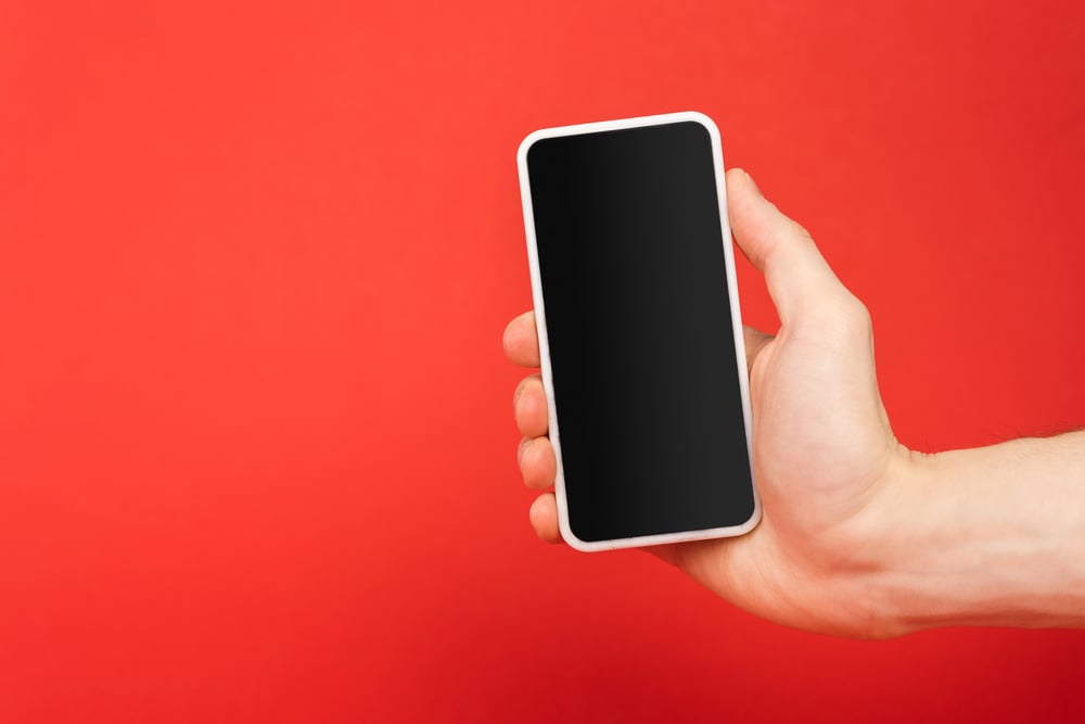 man holding smartphone