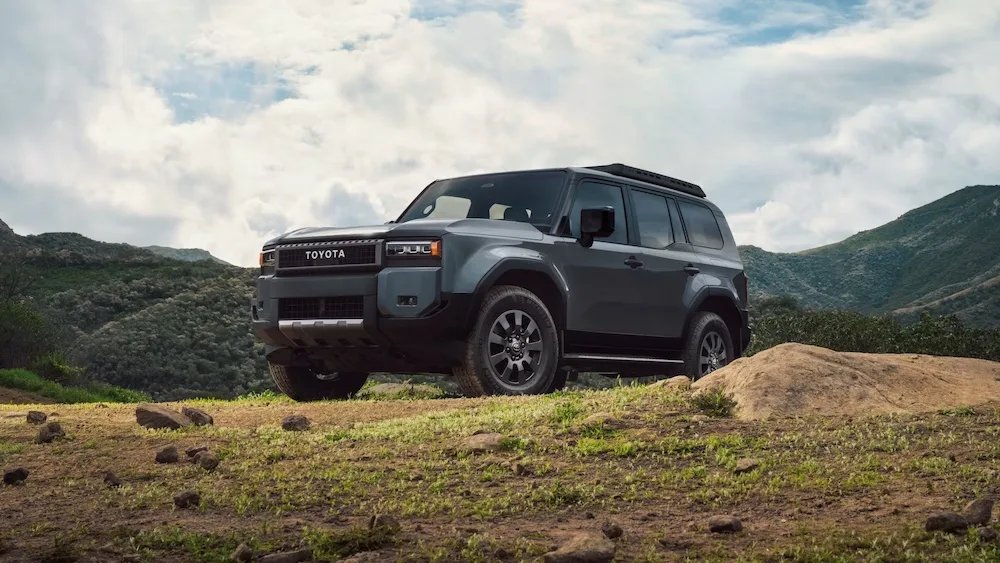 2025 Toyota Land Cruiser Wagon parked upon a grassy hill