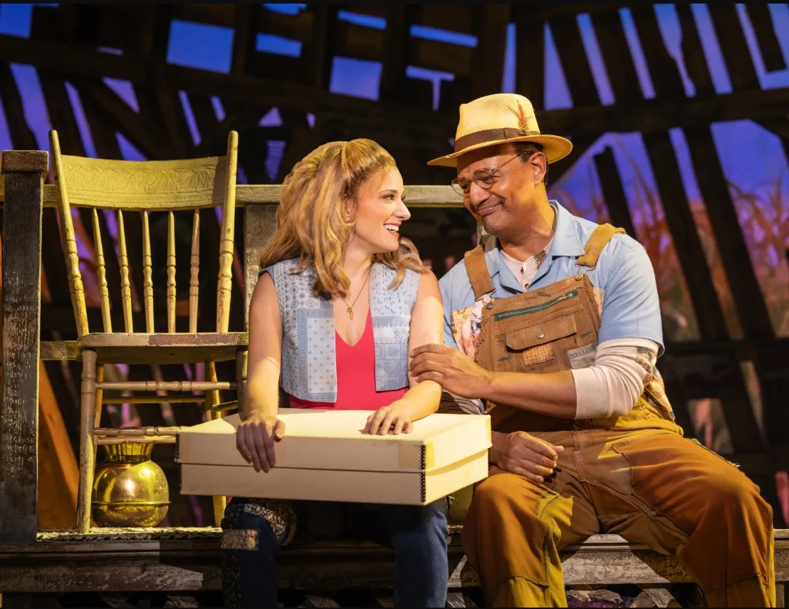 Danielle Wade as Maizy and Erick Pinnick as Grandpa in The North American Tour of SHUCKED. Photo by Matthew Murphy and Evan Zimmerman