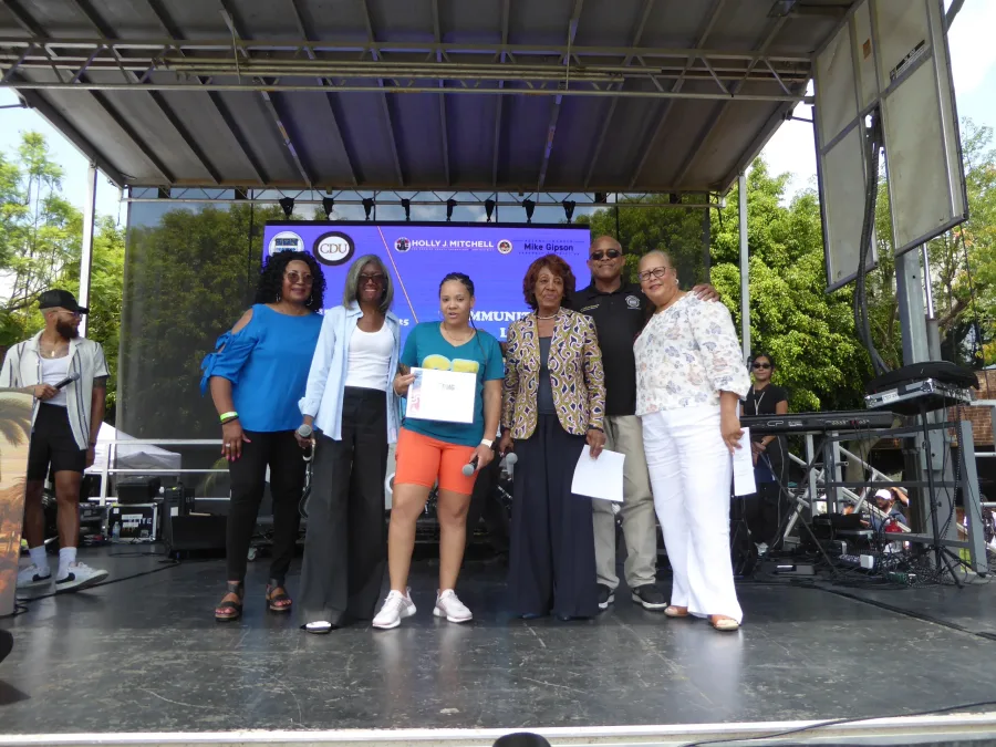 DeMira Pierre, (center) and Elected Officials: Photo Credit, Ricky Richardson