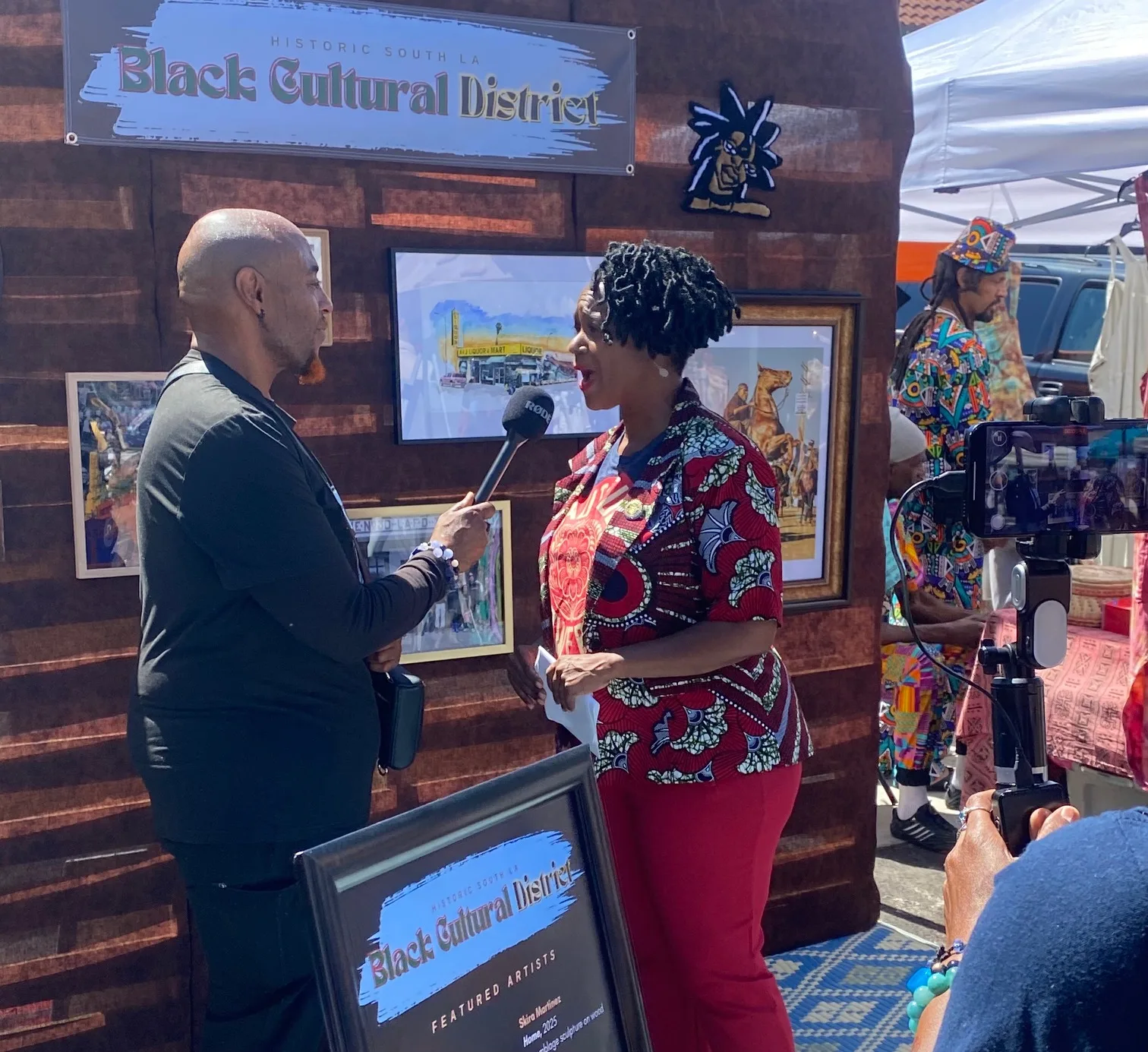 Senator Lola Smallwood-Cuevas speaks at the unveiling of the Historic South LA Black Cultural District during the Day of Ancestors Festival of Masks in Leimert Park. (Courtesy Photo)