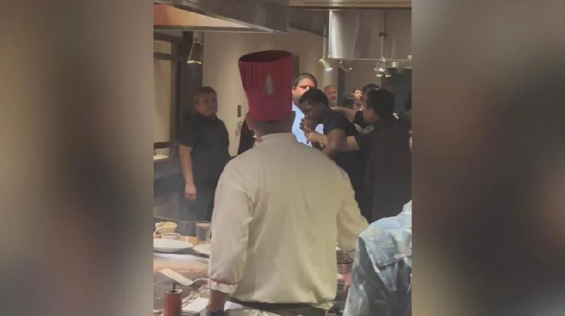 Elijah Dawkins seen in fight with Benihana security personnel