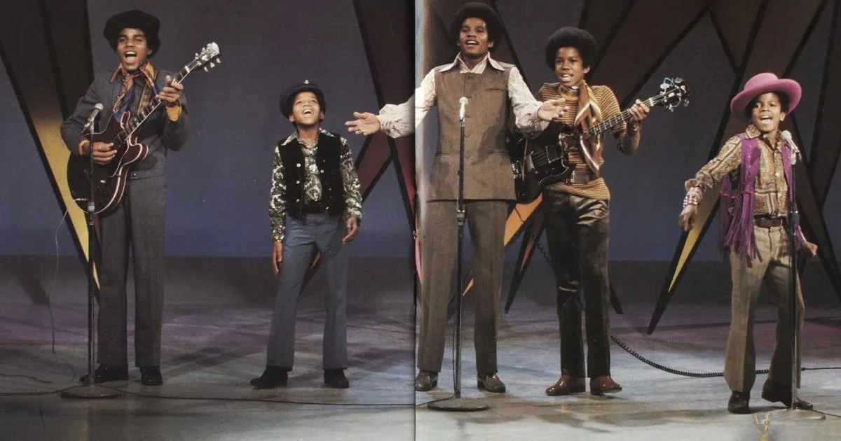 The Jackson 5 performing on stage during an appearance on &ldquo;The Ed Sullivan Show,&rdquo; with Michael Jackson singing alongside his brothers playing instruments.