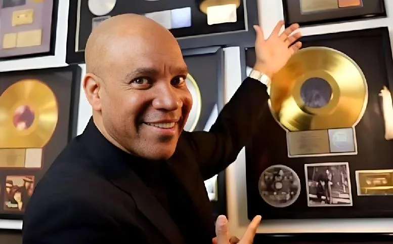 Kerry Gordy points to gold and platinum records awarded for landmark music projects