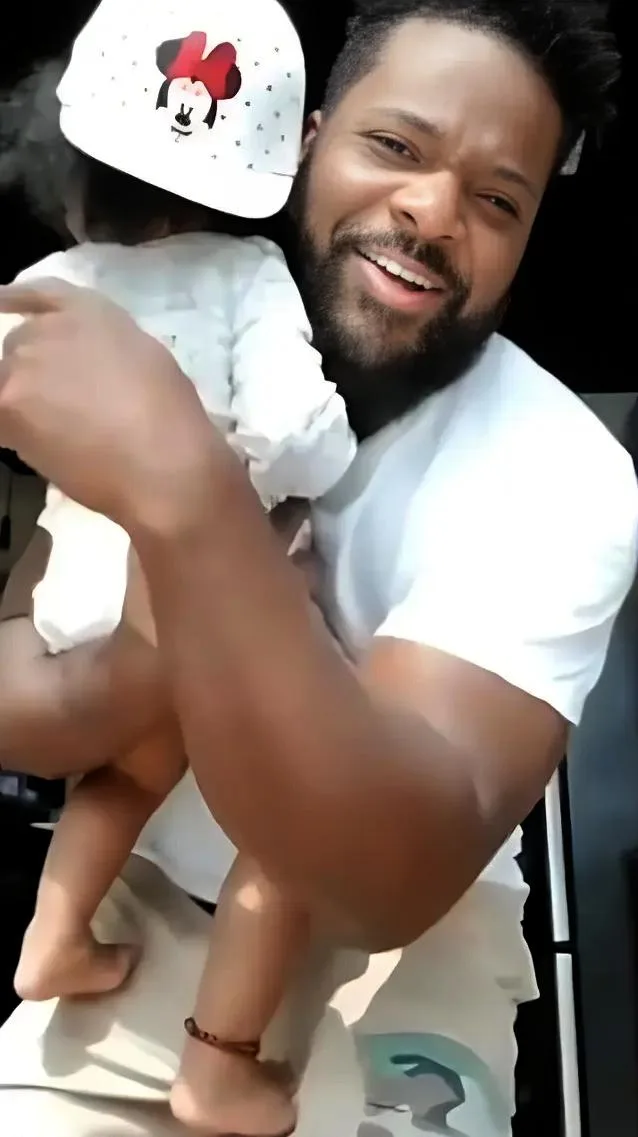 Malcolm Jamal Warner holding daughter - via Instagram
