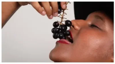 woman eating grapes