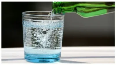 Pouring mineral water in the glass
