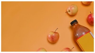 Apple cider vinegar and fresh red apples/iStock