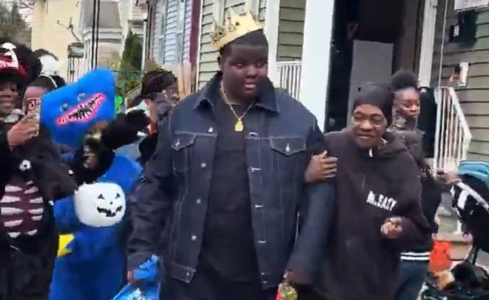 teen dresses as The Notorious B.I.G. for Halloween.