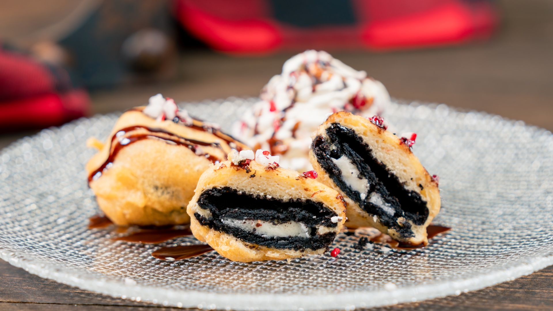 …Don’t forget the Milk & Cookies: Battered and fried crème-filled cookies with whipped topping, chocolate drizzle, and crushed peppermint candy. (Available Nov. 14 through Jan. 7. Location: Hollywood Land