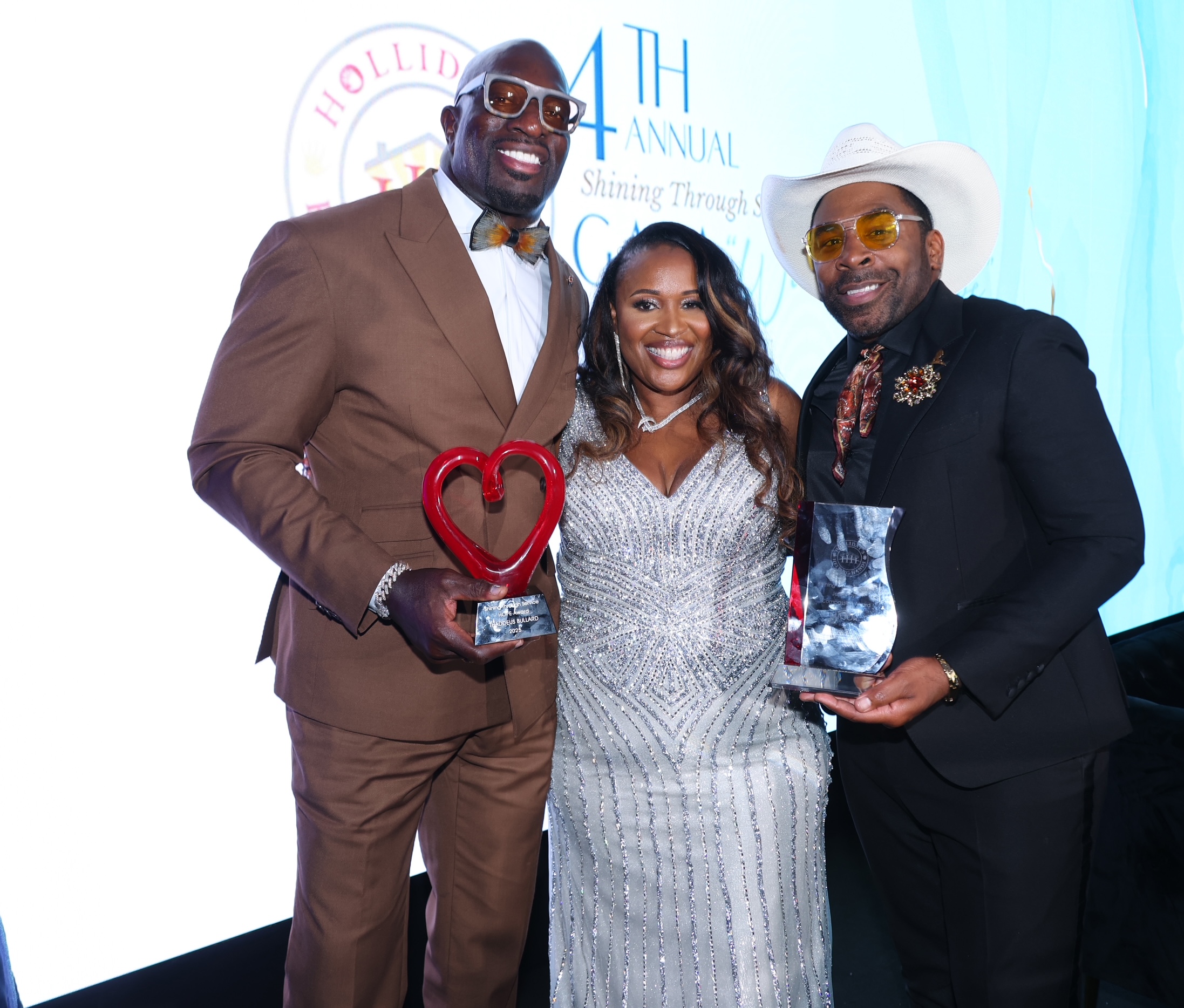 Thaddeus Bullard, Katina Holliday, and recording artist MAJOR. at the &ldquo;Waves of Hope&rdquo; Gala.