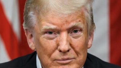 A stern-looking Donald Trump - via GrokAI