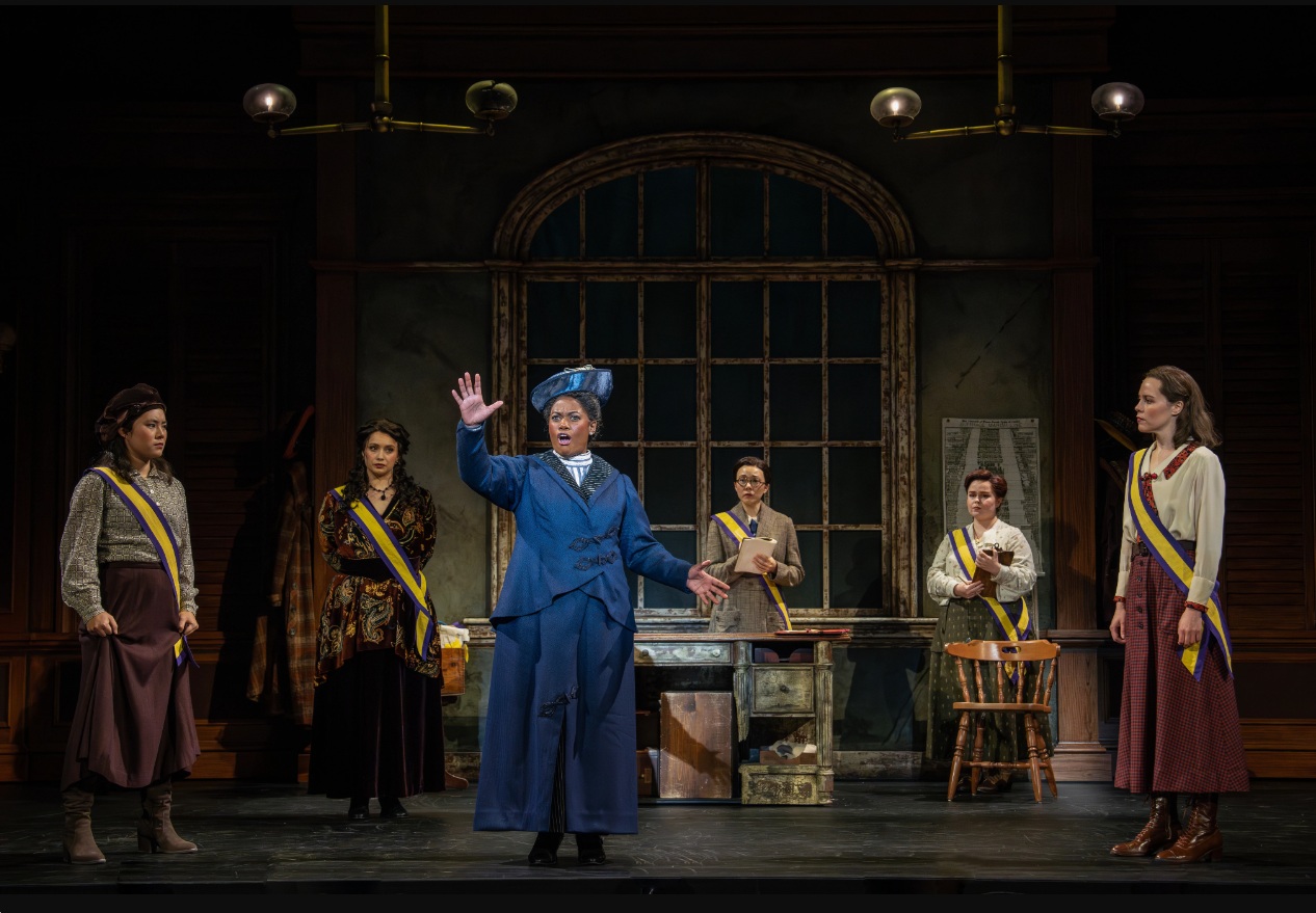 Danyel Fulton (Ida B. Wells) and company in the First National Touring Company of SUFFS. Photo by Joan Marcus, 2025.