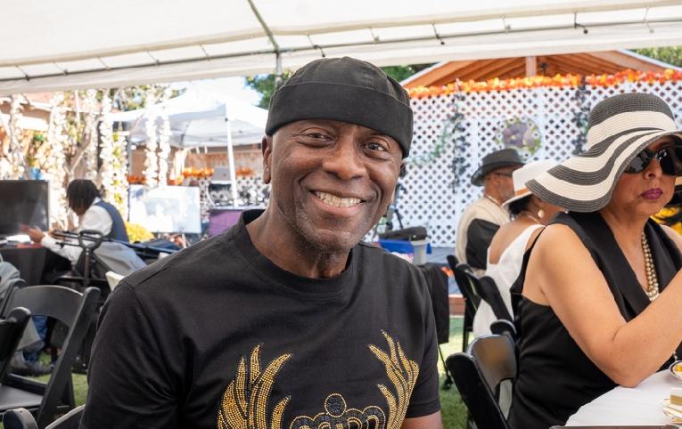 One's smiling ... the other's enjoying the food! ... Both former Soul Train dancers enjoying the day at Damita Jo's!