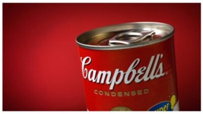 Close-Up of a Sealed Campbell's Soup Can on Red Background stock photo