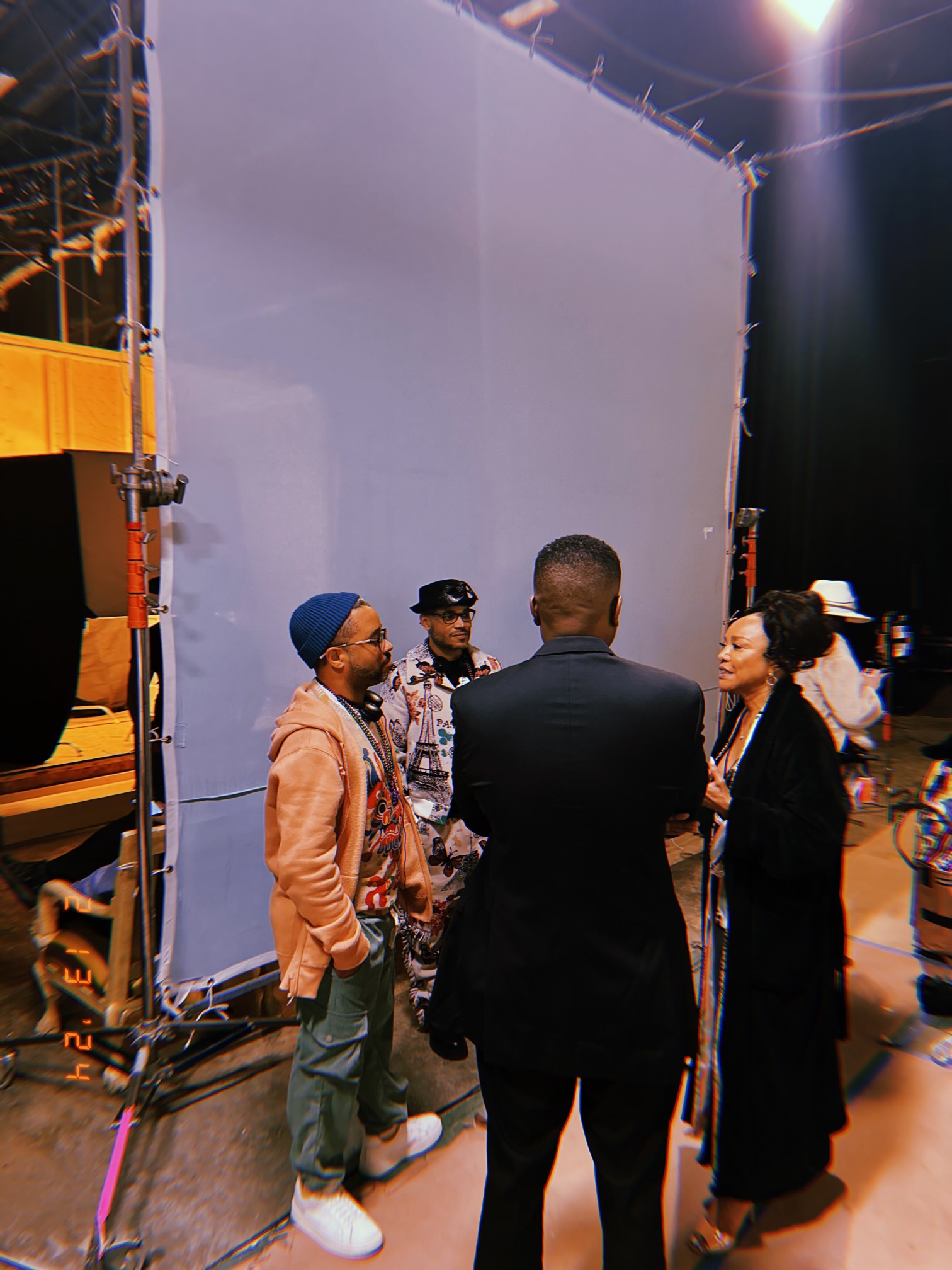 Deondray Gossfield and Quincy LeNear Gossfield on set with actress Lynn Whitfield and crew members during filming.