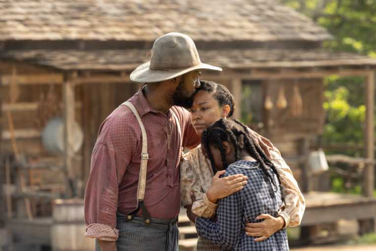 Kenric Green, Sonequa Martin-Green, and a young actress share an emotional embrace in a scene from &ldquo;Sarah&rsquo;s Oil.&rdquo;