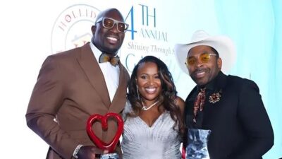 Thaddeus Bullard and MAJOR with Holliday’s Helping Hands founder Katina Holliday