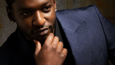 Jay Will portrait wearing a navy suit during Tulsa King Season 3 promotion