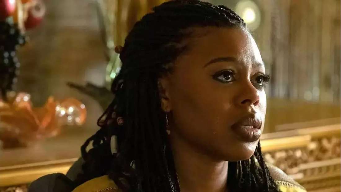 Gail Bean as Wanda in &ldquo;Snowfall,&rdquo; looking emotional in a dramatic indoor scene.