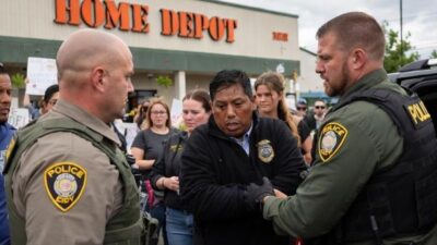 A tense moment outside a New Orleans Home Depot parking lot with federal agents detaining a Latino Day laborer