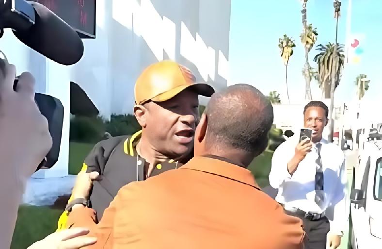 LJ Guillory and Najee Ali (back to camera) go at it - screenshot