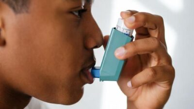 A teenage male using an asthma inhaler - via eurAI