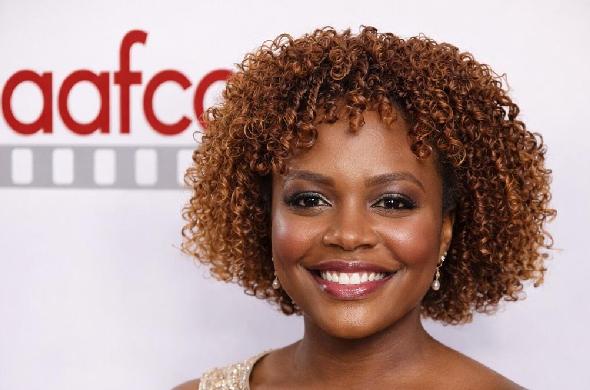 Karine Jean-Pierre wth AAFCA logo in background