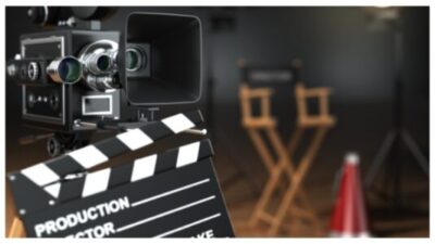 Video, movie, cinema concept. Retro camera, flash, clapperboard stock photo