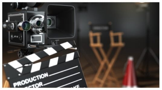 Video, movie, cinema concept. Retro camera, flash, clapperboard stock photo