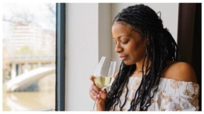woman drinking a glass of wine