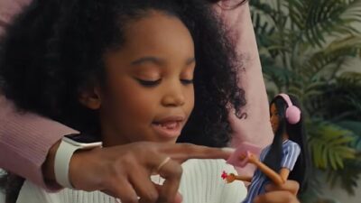 Young girl introduced to Mattell's autistic doll