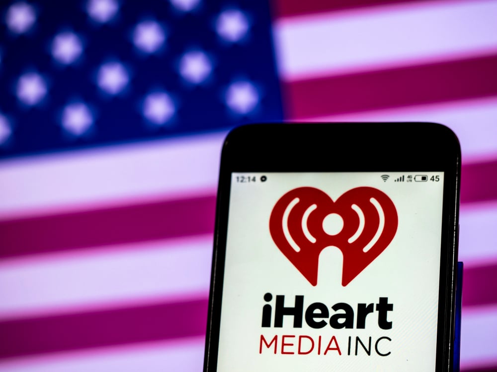 iHeartMedia logo on smartphone