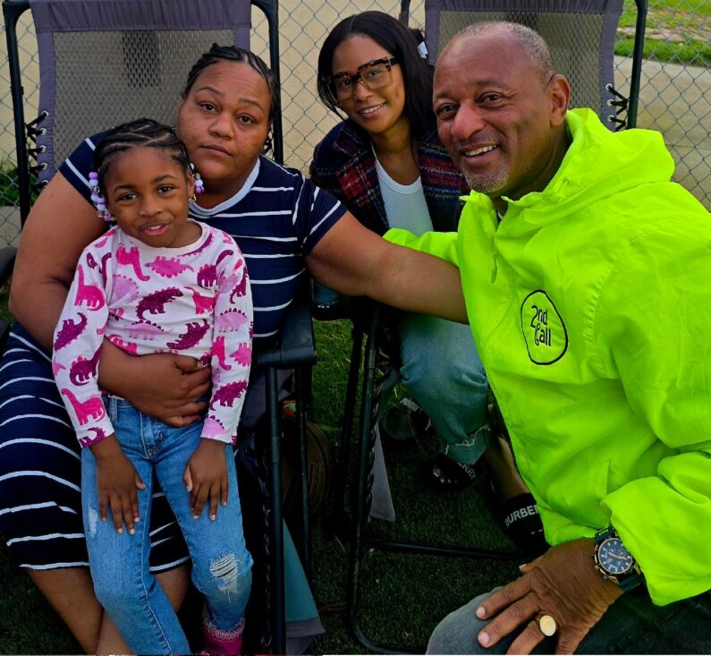 Michelae Jones holds Beautyful with her sister Kira Townsend and Najee Ali
