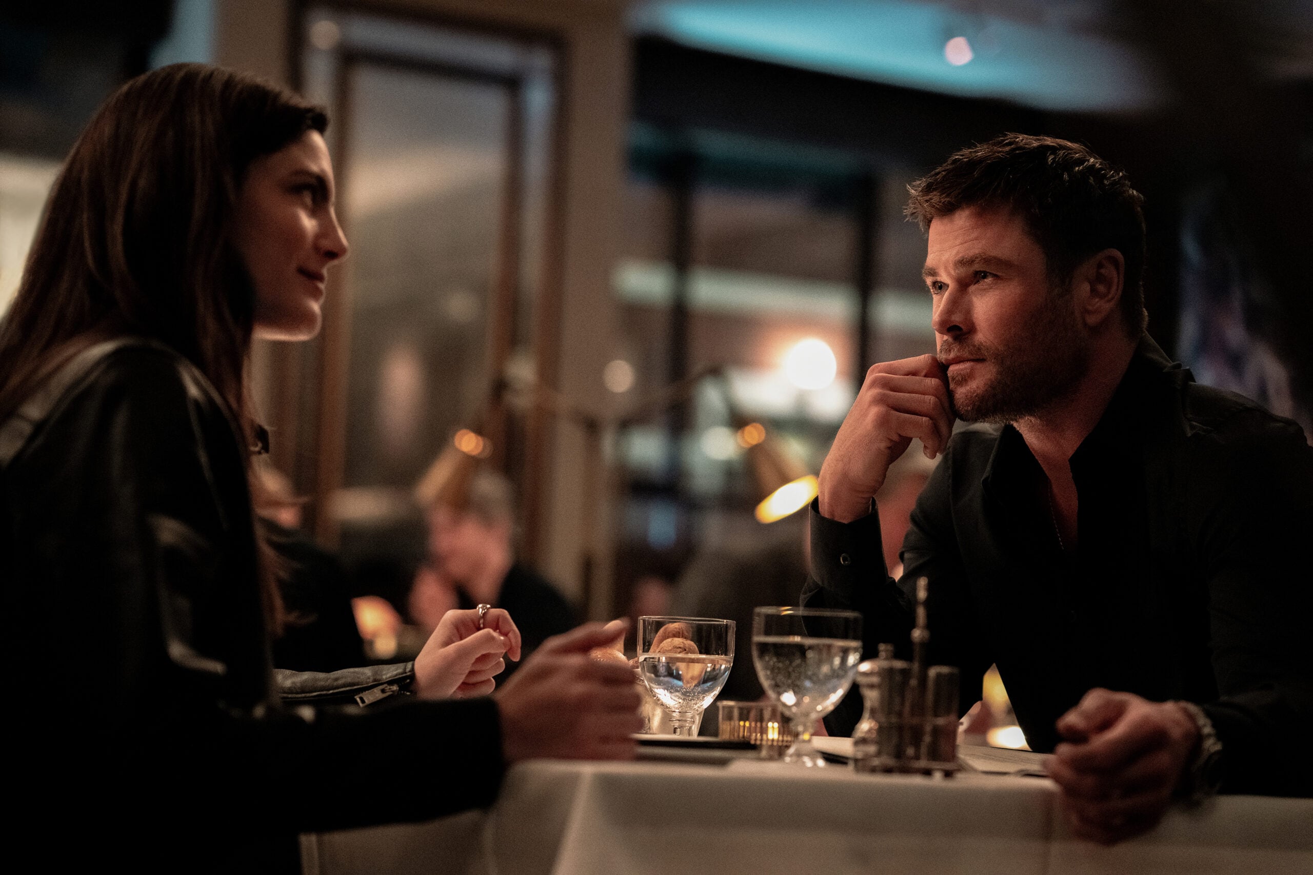 Monica Barbaro and Chris Hemsworth in CRIME 101. Photo Credit_ Dean Rogers (love interest)