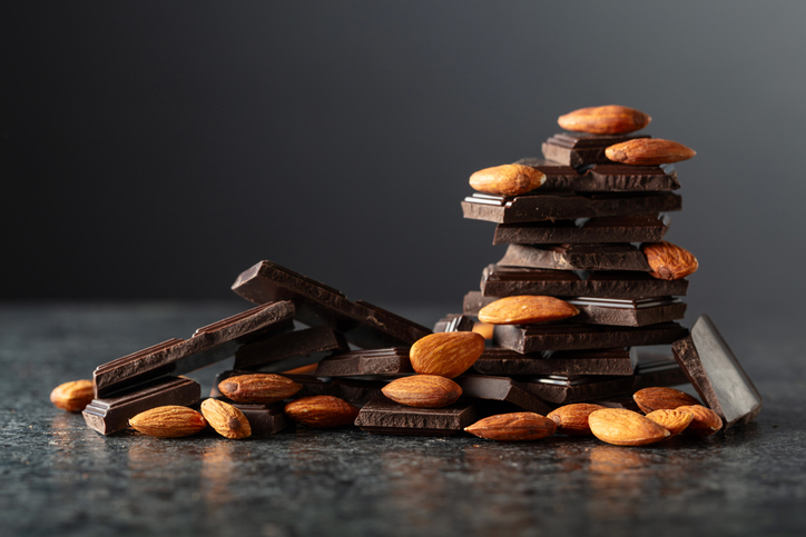 Broken dark chocolate bar with almond