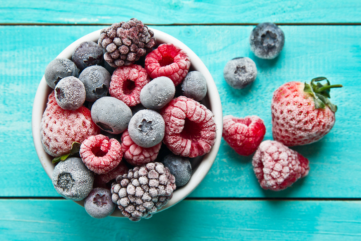 Frozen berries in a bowl. Various mix berry stock photo...
